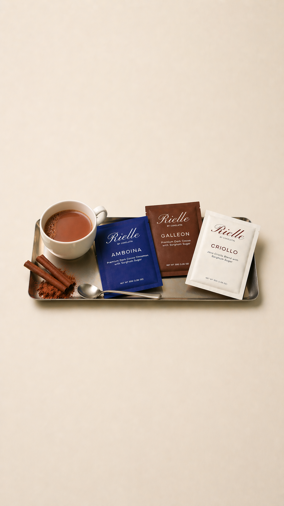 A tray of Rielle cocoa products with hot chocolate and cinnamon
