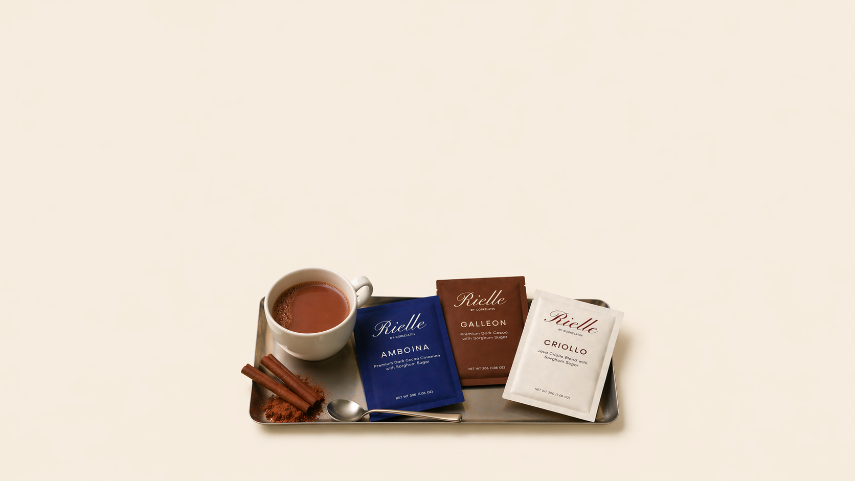 A tray of Rielle cocoa products with hot chocolate and cinnamon